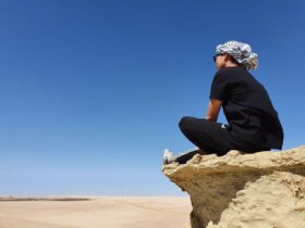 Enjoying a peaceful moment overlooking the Egyptian desert during a holiday adventure tour